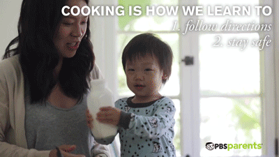 cooking is how we learn to follow directions and stay safe. toddler shaking milk bottle. gif by PBS