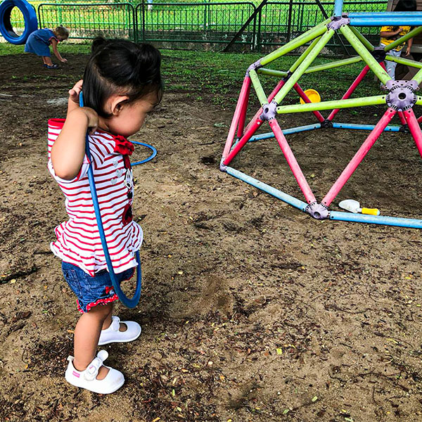 Little girl at Chicky & Olive playground