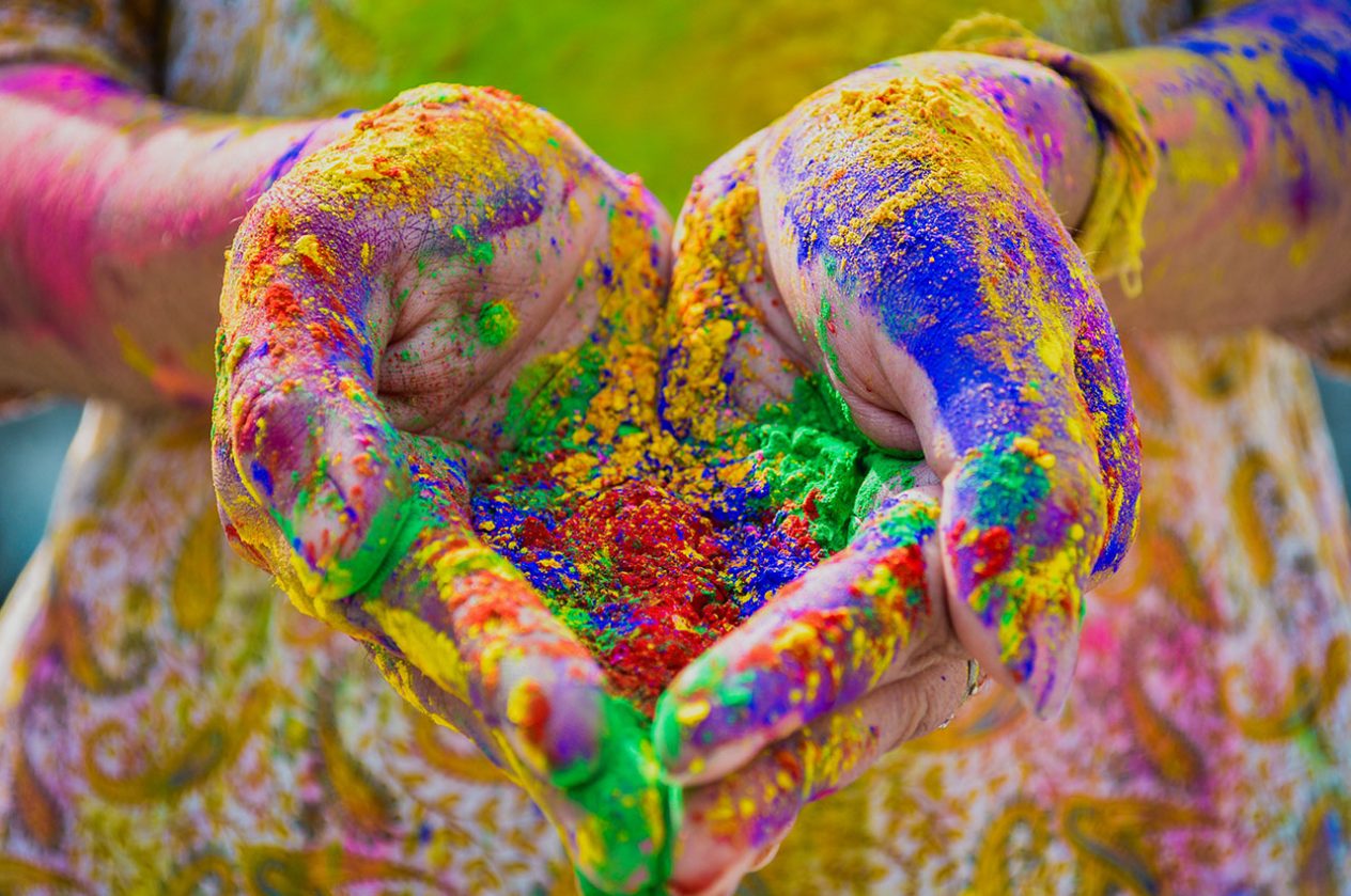 hands full of coloured powder