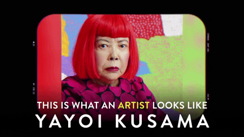 Artist Yayoi Kusama's signature look - red bobbed hair and polka dot dress