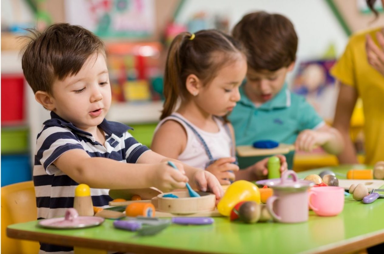 preschool children playing in classroom